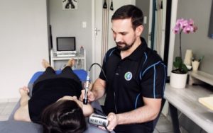 Demonstration of physiotherapy treatment called laser therapy